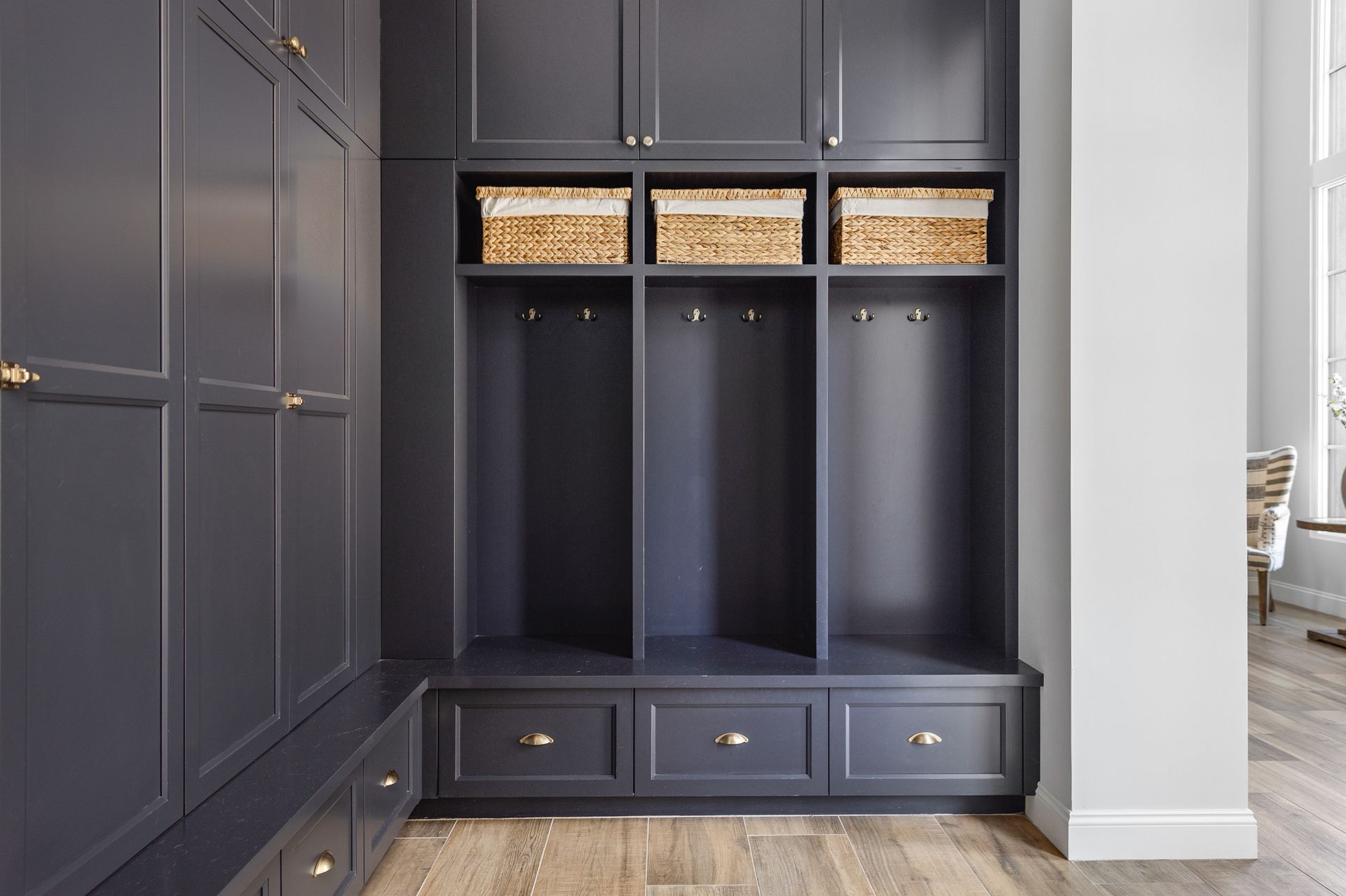 luxury mudroom with cabinets and shelving