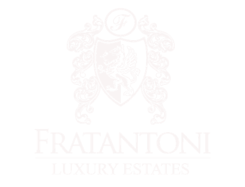 The logo for fratantonio luxury estates is a shield with a lion on it.