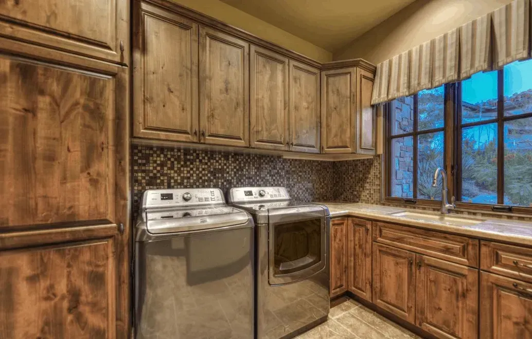 Elegant laundry room with calming color palette