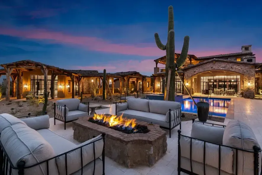 Custom outdoor kitchen with built-in grill and stonework
