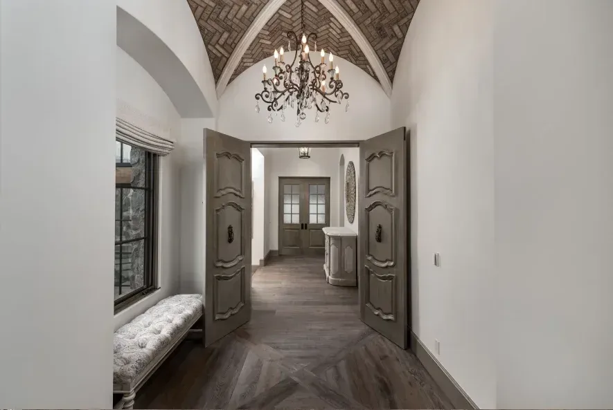 Rustic home with vaulted ceiling and natural wood beams