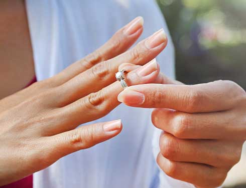 Divorce — Woman Removing Her Wedding Ring in Kennett, MO Divorce — Woman Removing Her Wedding Ring in Kennett, MO