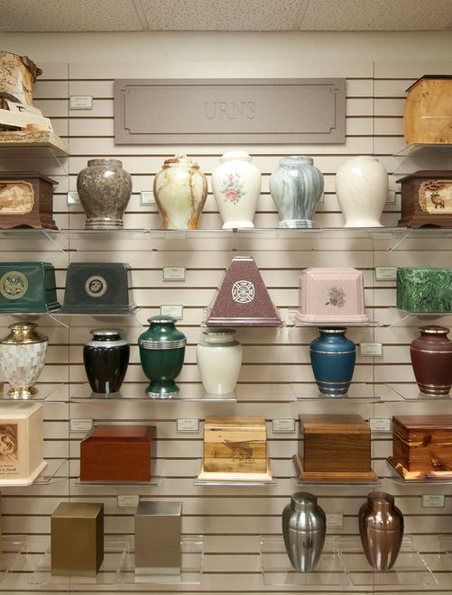 A display of urns and vases on a wall