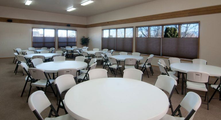A large room filled with tables and chairs