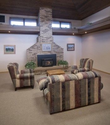 A living room filled with furniture and a fireplace