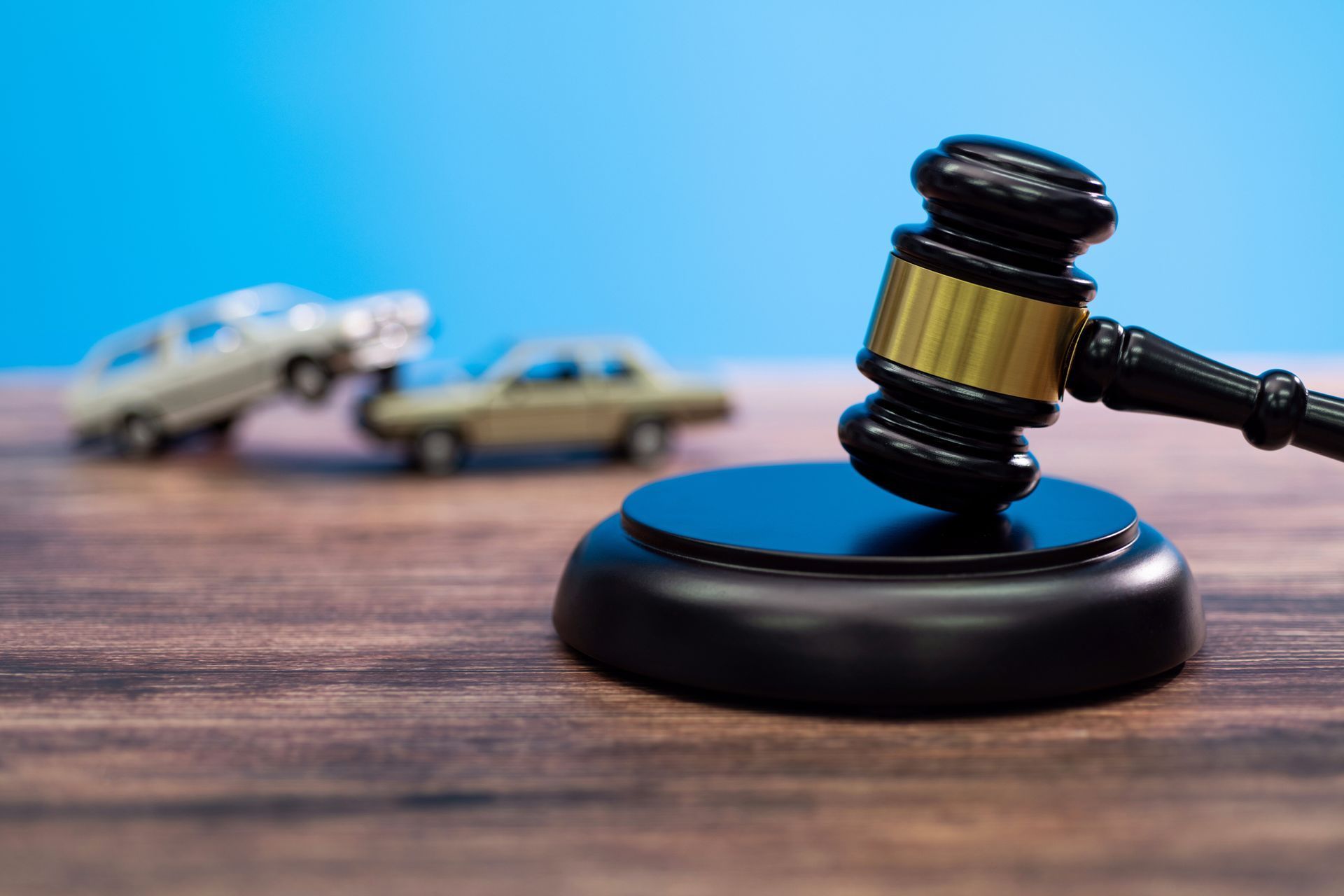 Gavel on Stand With Toy Cars Crashed — Dwyer Law Group in Surfers Paradise, QLD