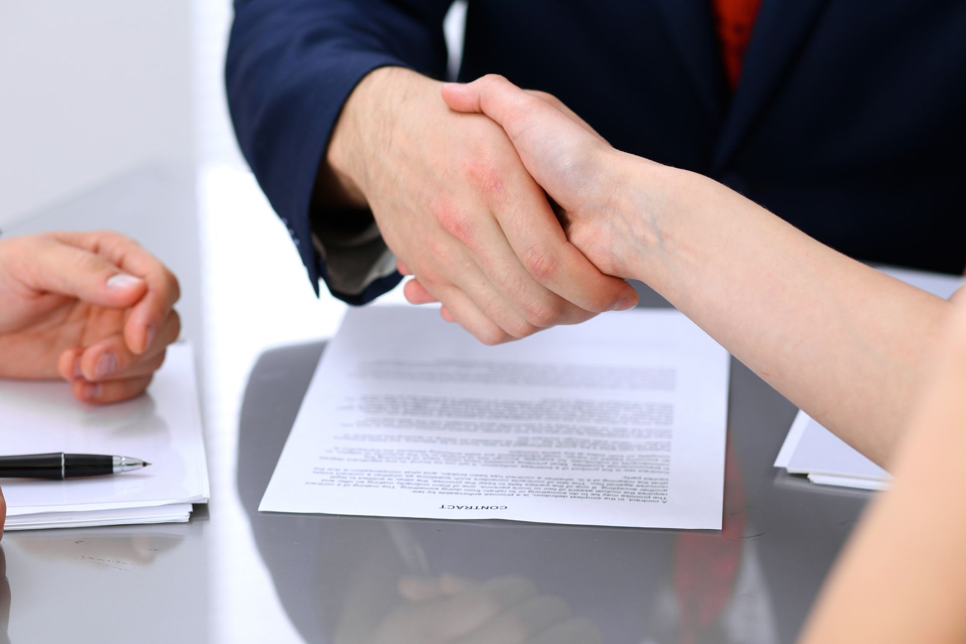 Two People Shaking Hands — Dwyer Law Group in Surfers Paradise, QLD