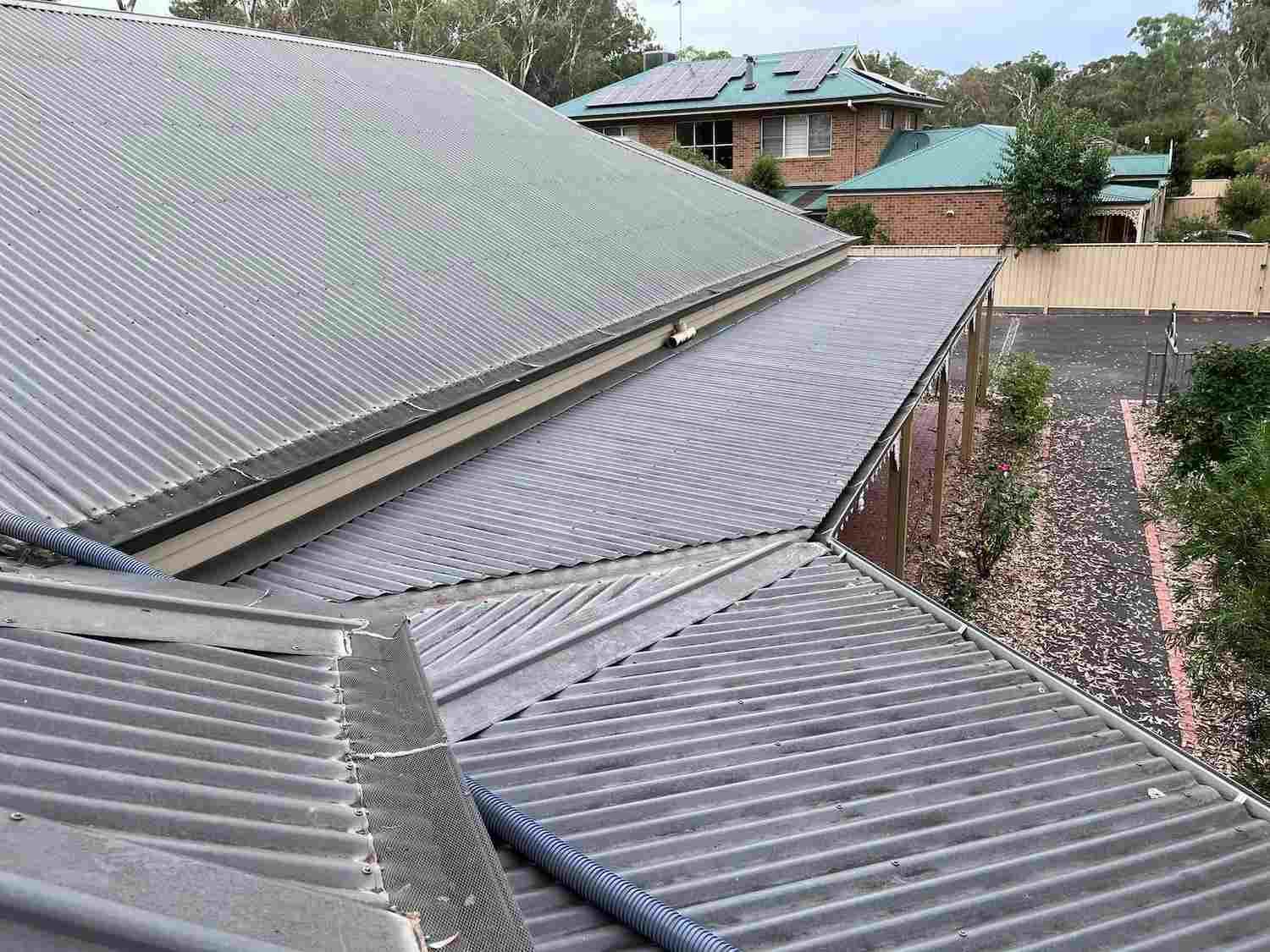 The Roof of a House With a Corrugated Metal Roof — GUTTER MUNCHER In Bendigo, VIC