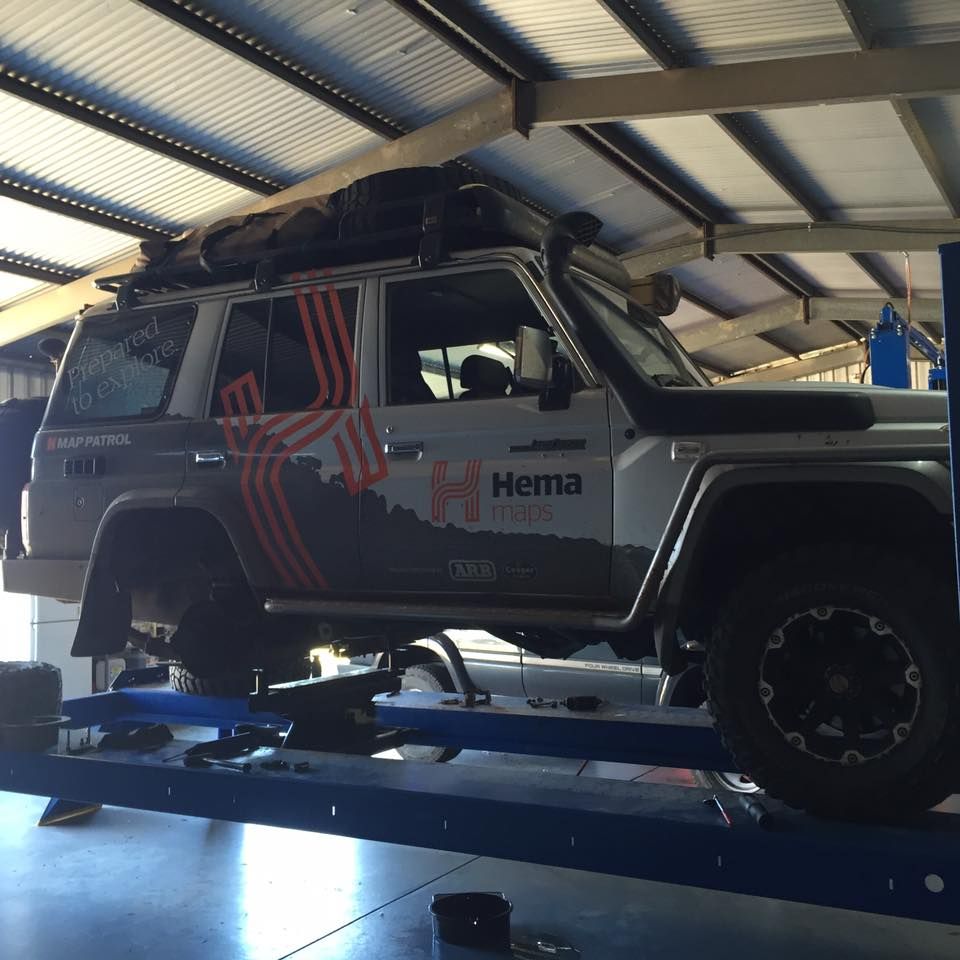 A Hema Vehicle Is On A Lift In A Garage — Red Central Towing & Recovery In Alice Springs, NT