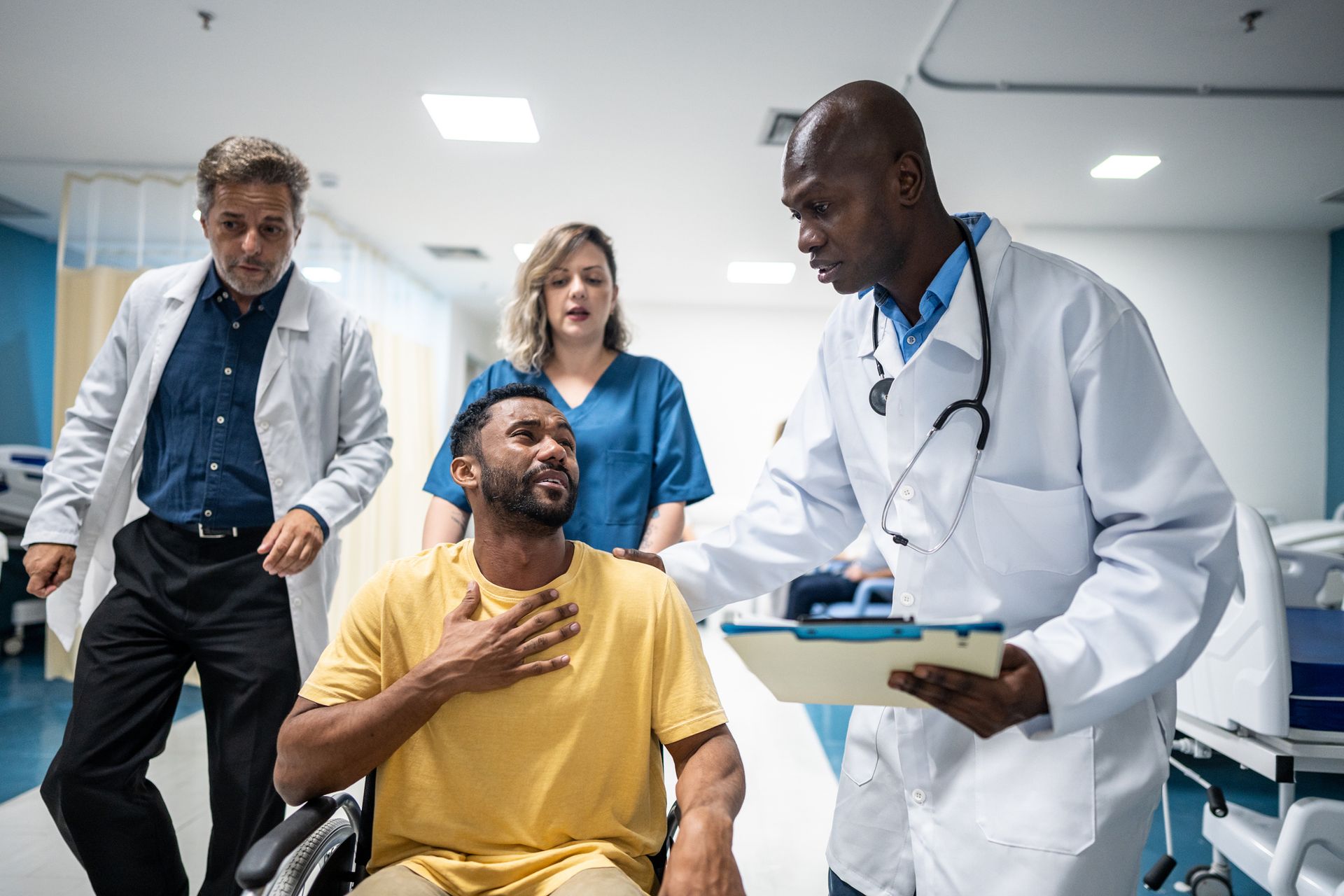 A man in a suit is holding a briefcase in a library.