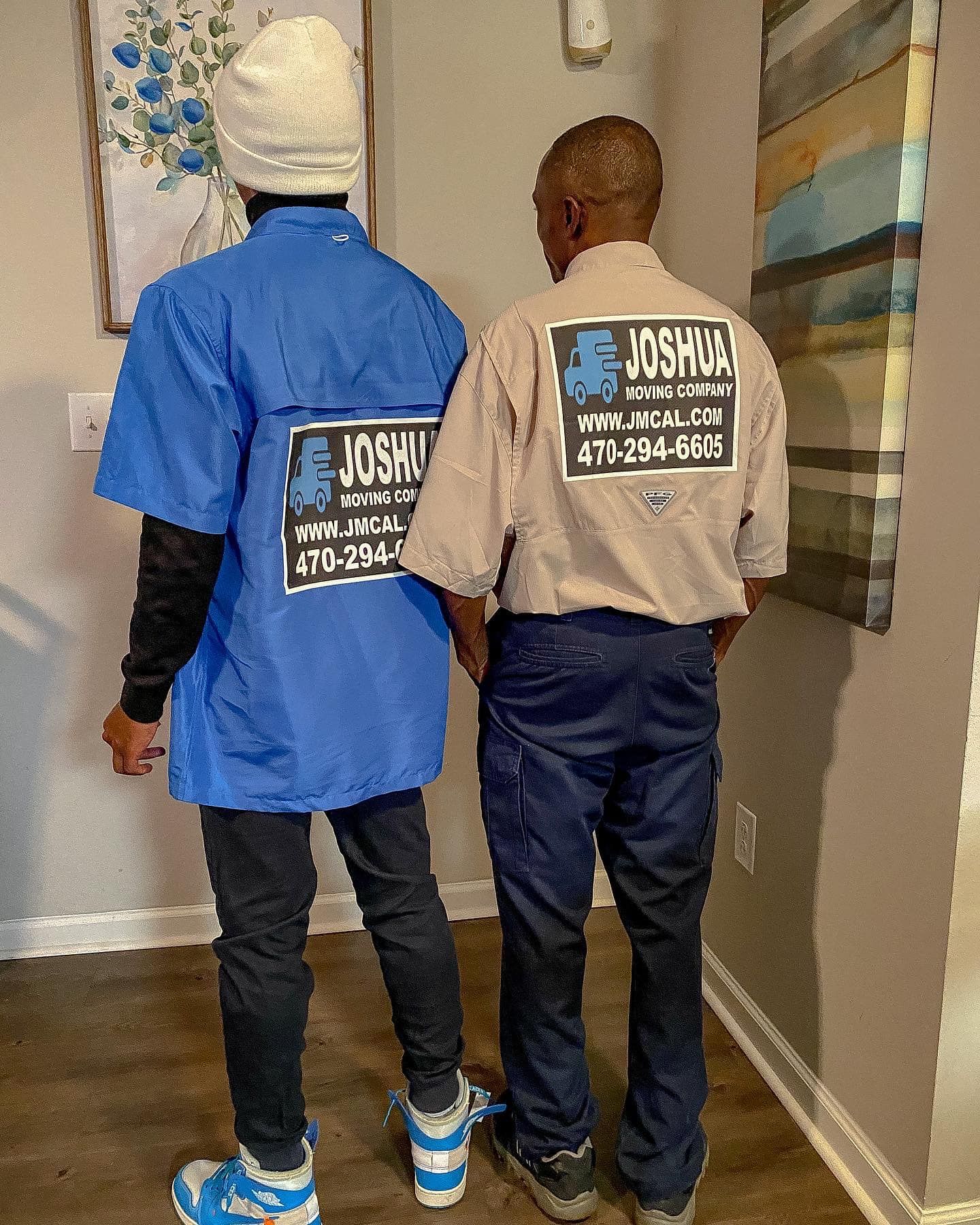 Two people in work shirts with