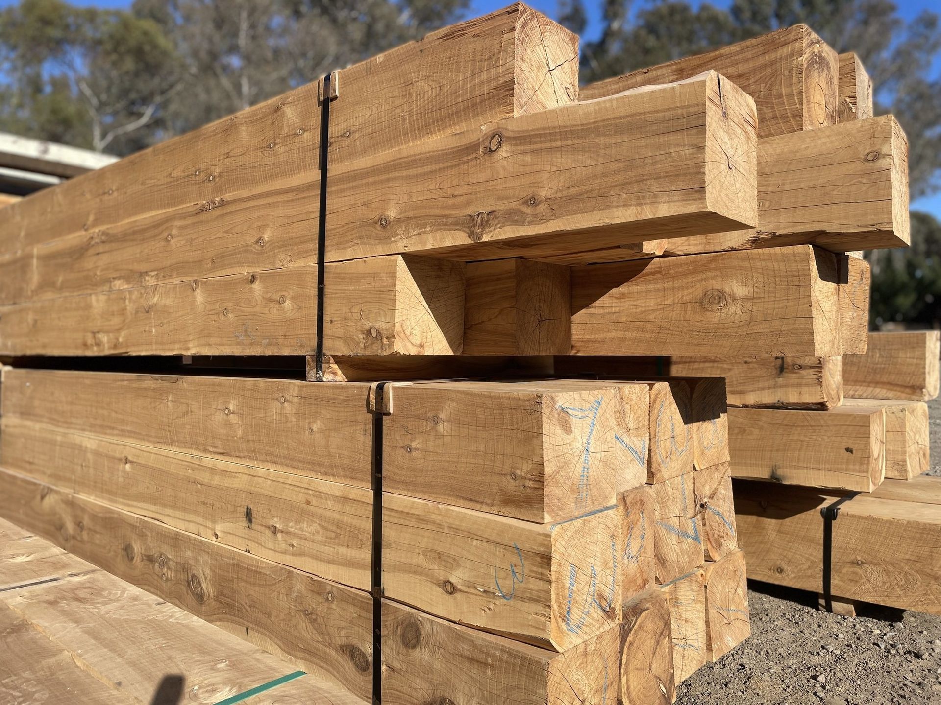 A pile of wooden beams stacked on top of each other.