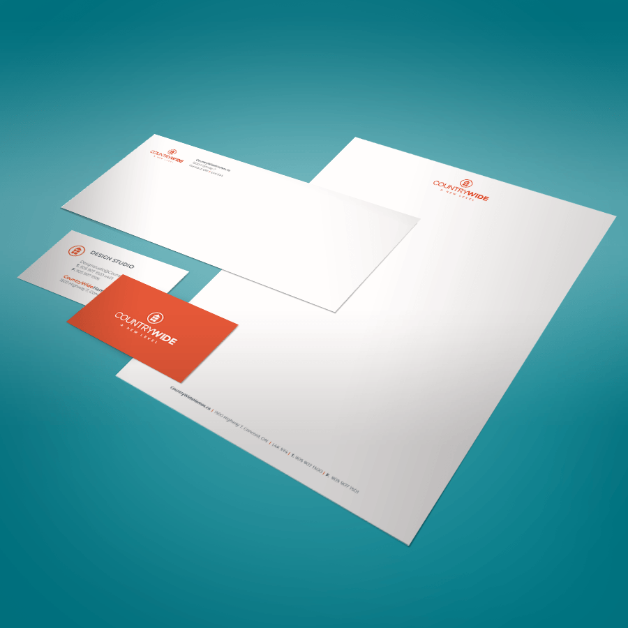 A set of envelope , letterhead , and business card on a blue surface.