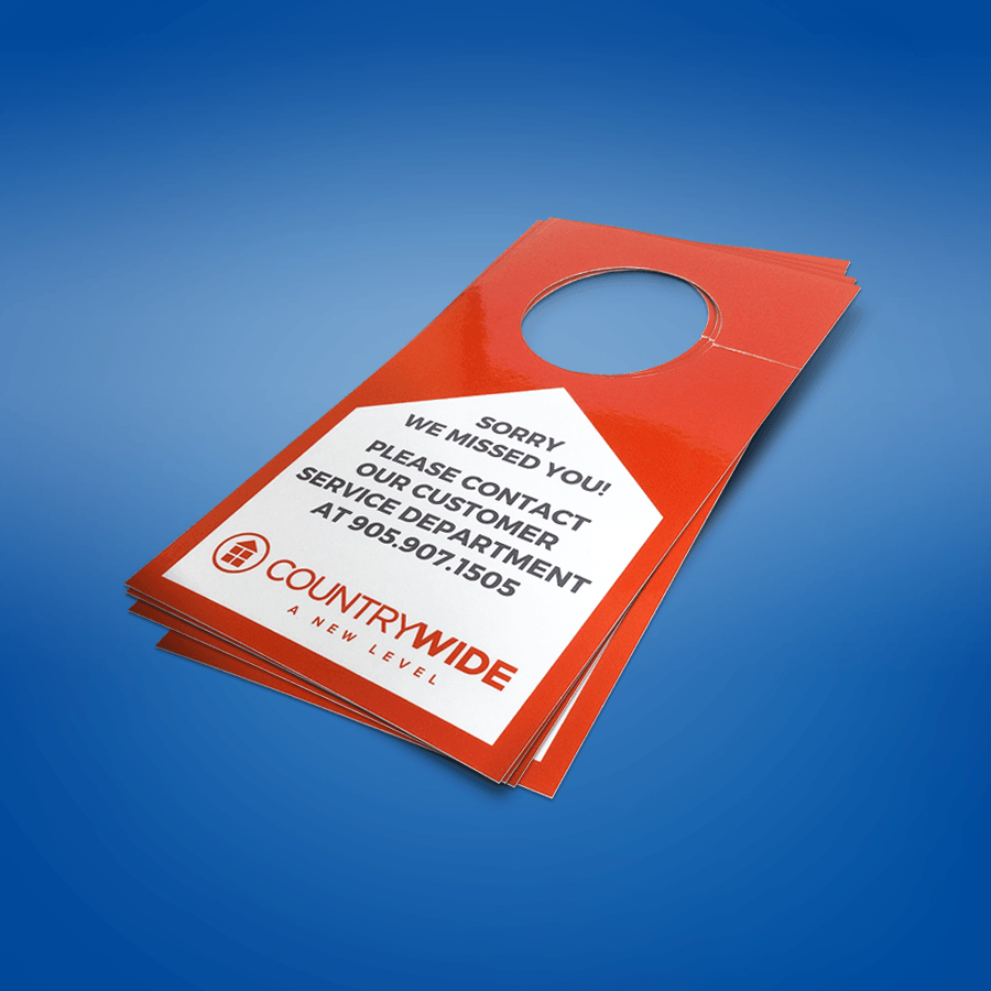 A red door hanger that says sorry we missed you