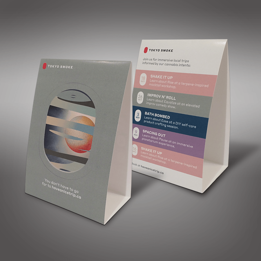 A couple of cards sitting on top of each other on a table.