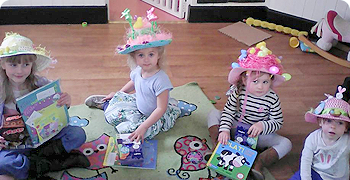 little children wearing fancy hats