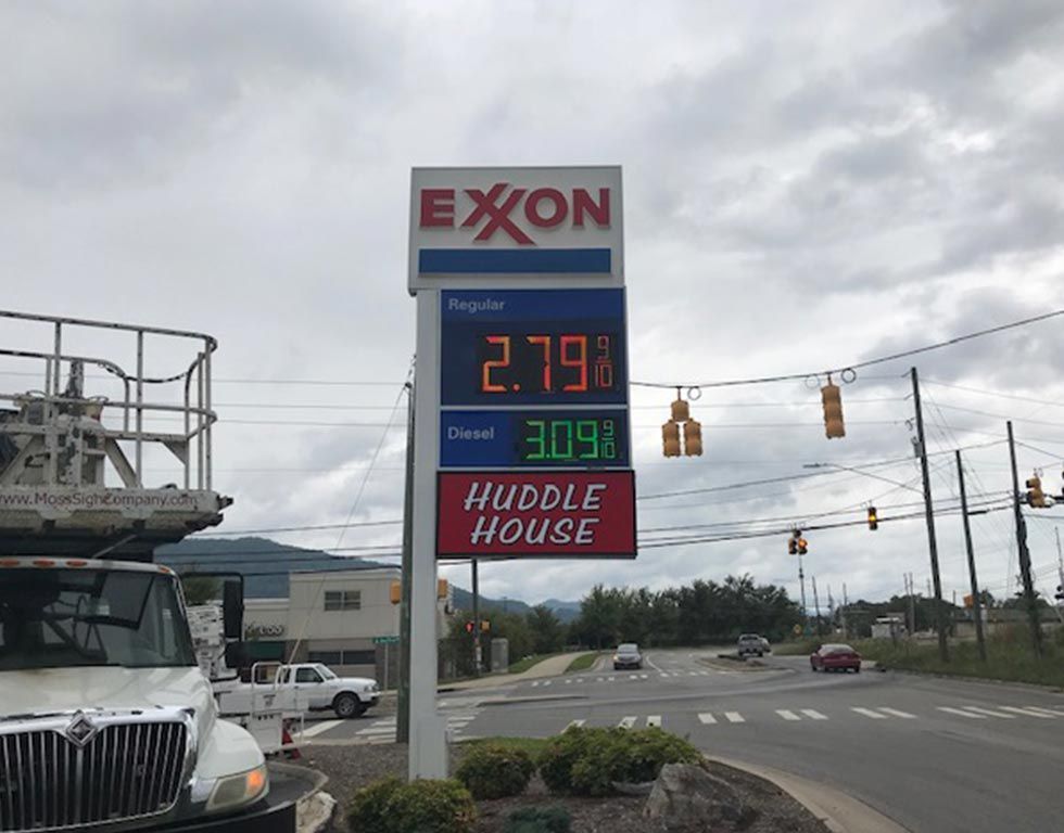 Exxon gas station sign displaying gas prices: $2.79 for regular and $3.09 for diesel, with a 