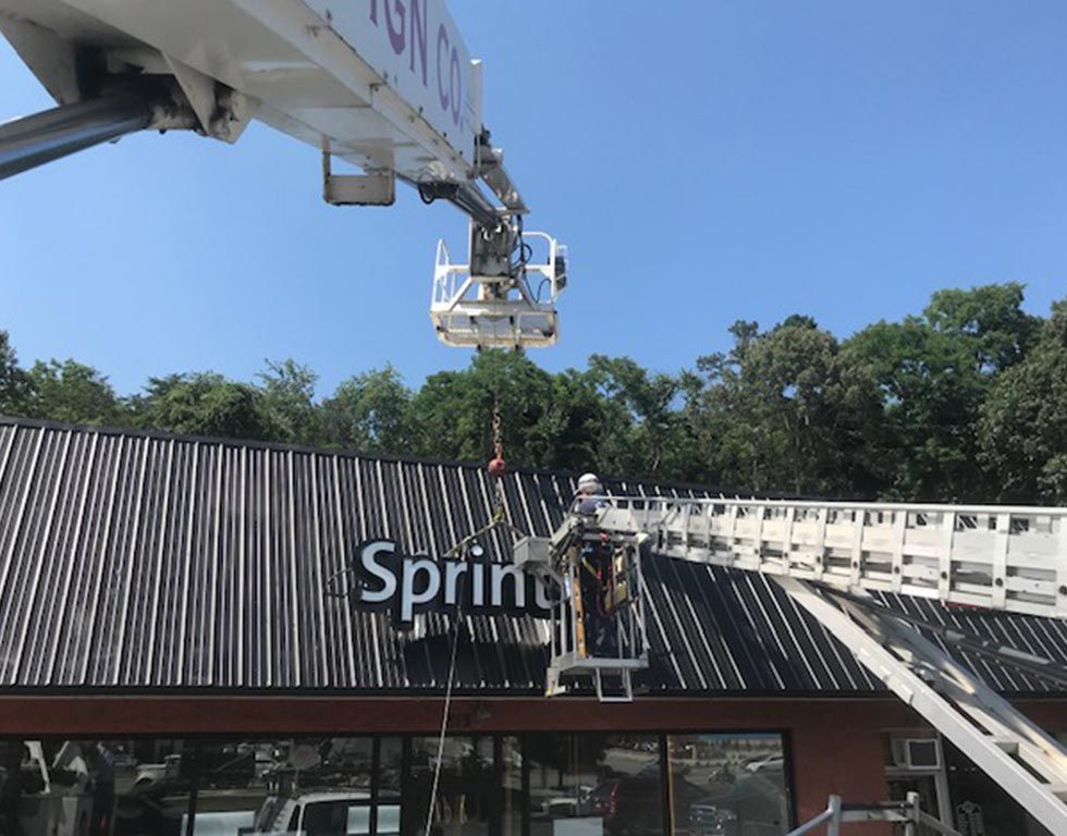 Workers in a lift removing a 