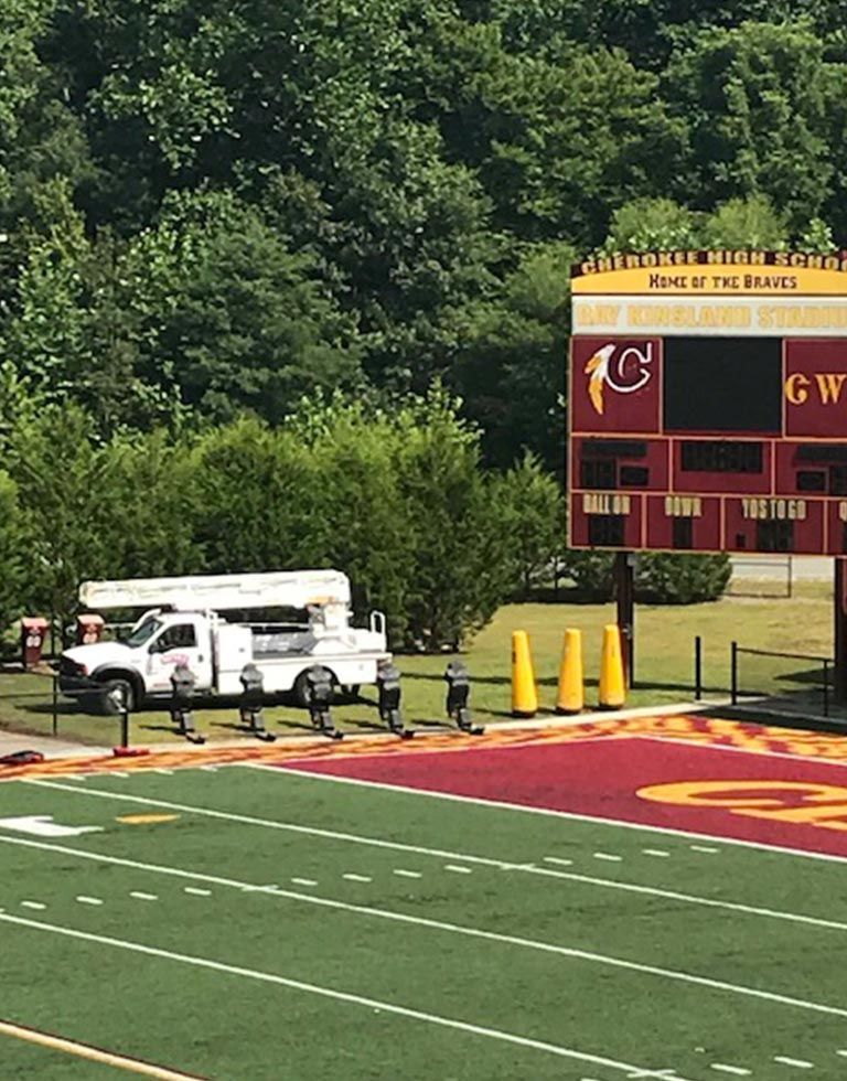 Football field with a scoreboard that reads 