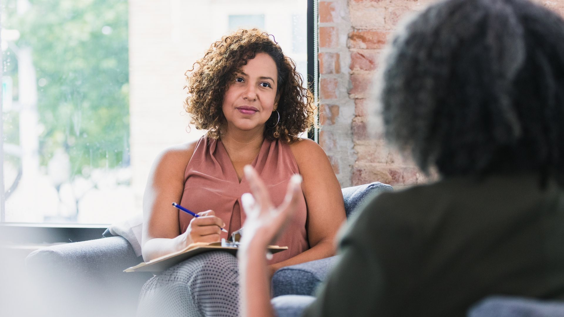 staff members discuss support hours based on evidence