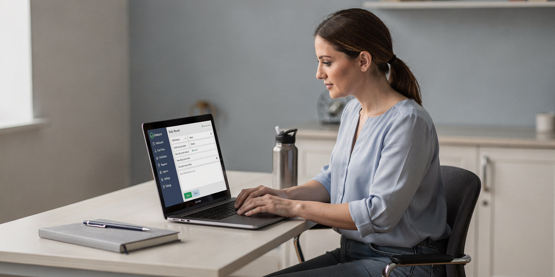 Woman working on a laptop at a desk in a bright home office