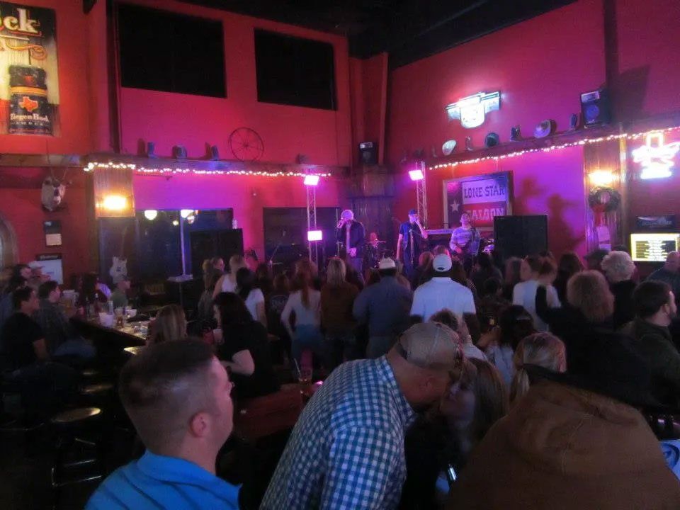 Country western saloon guests enjoying live music in Richmond, TX