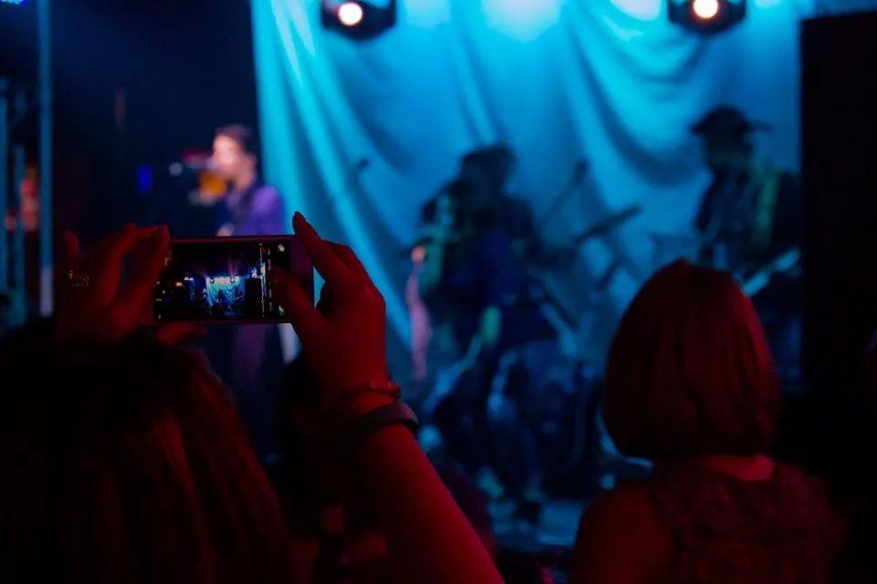 Fan watching live music performance in Richmond, TX