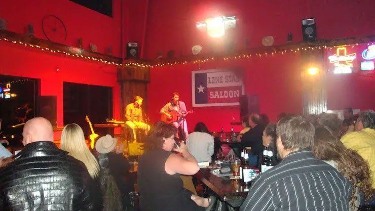 people dancing at country western saloon