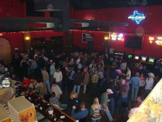 people dancing at country western saloon