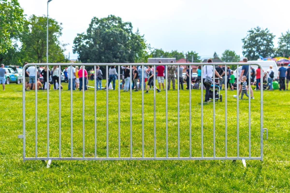 A group of people near a temporary fence rental near Lexington, Kentucky (KY)