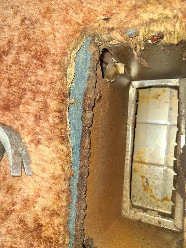 A close up of a hole in a wall