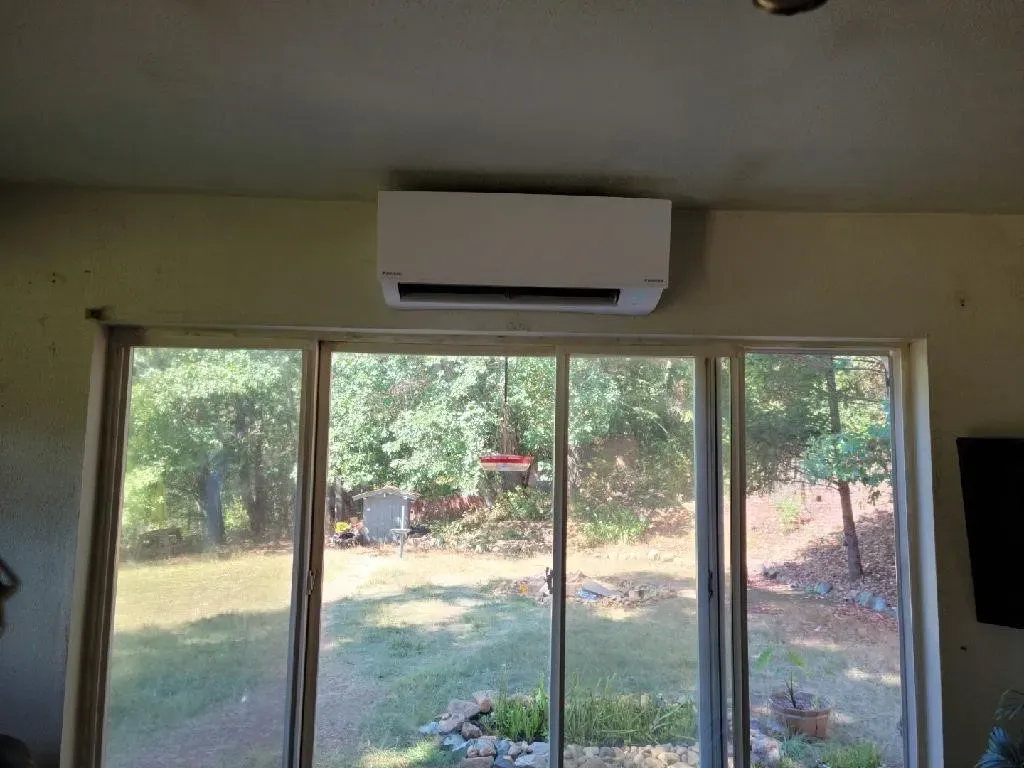 A duct in a basement with a lot of insulation on it