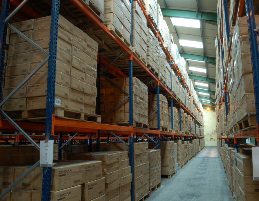 a large warehouse filled with lots of boxes and pallets