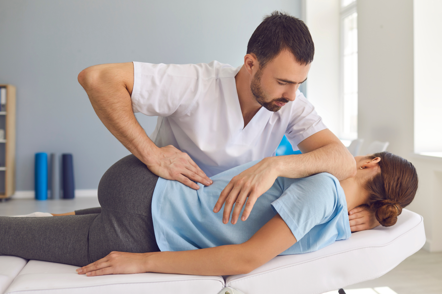 chiropractor with a patient 