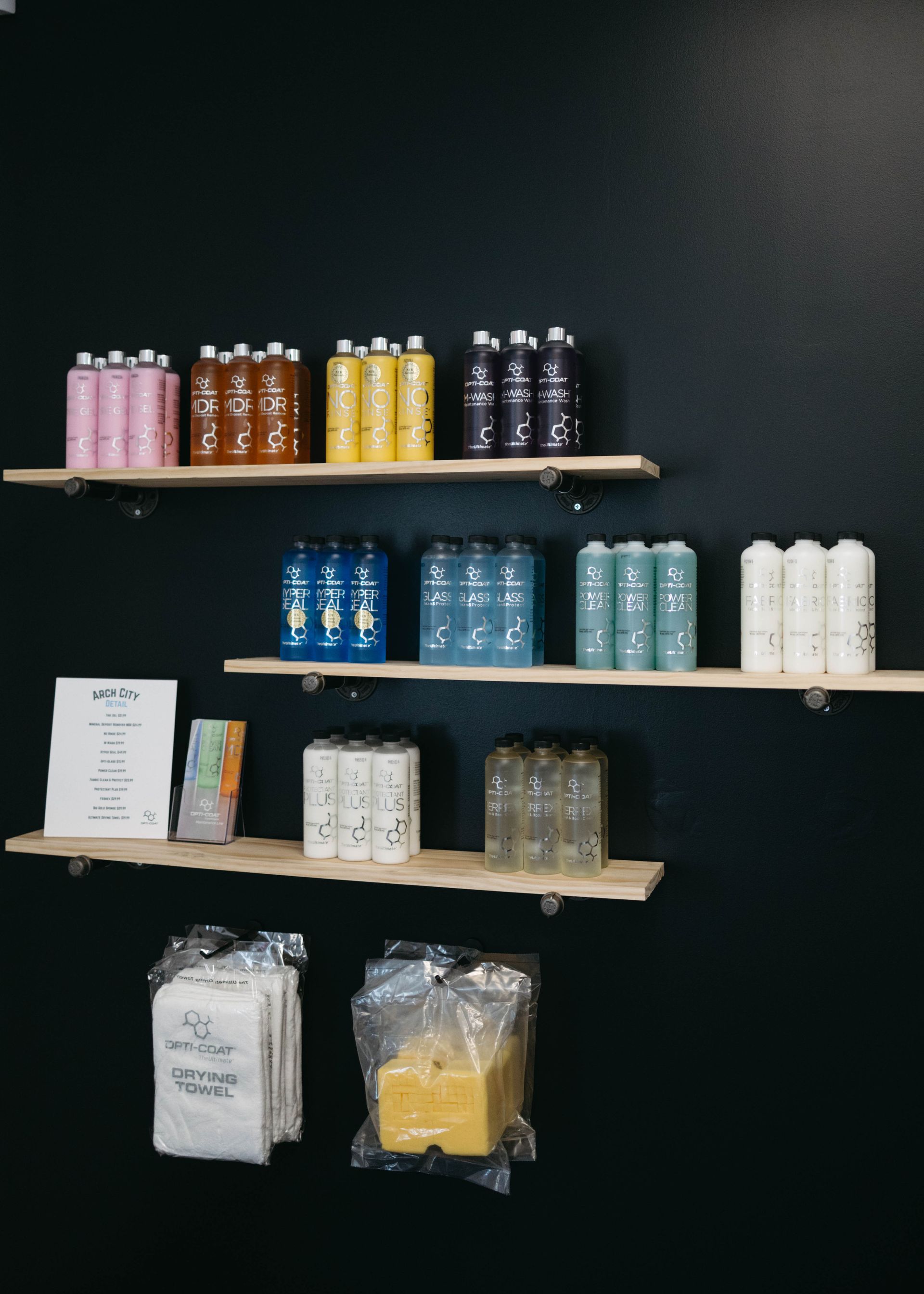 Shelves with colorful bottles and packages against a dark wall.