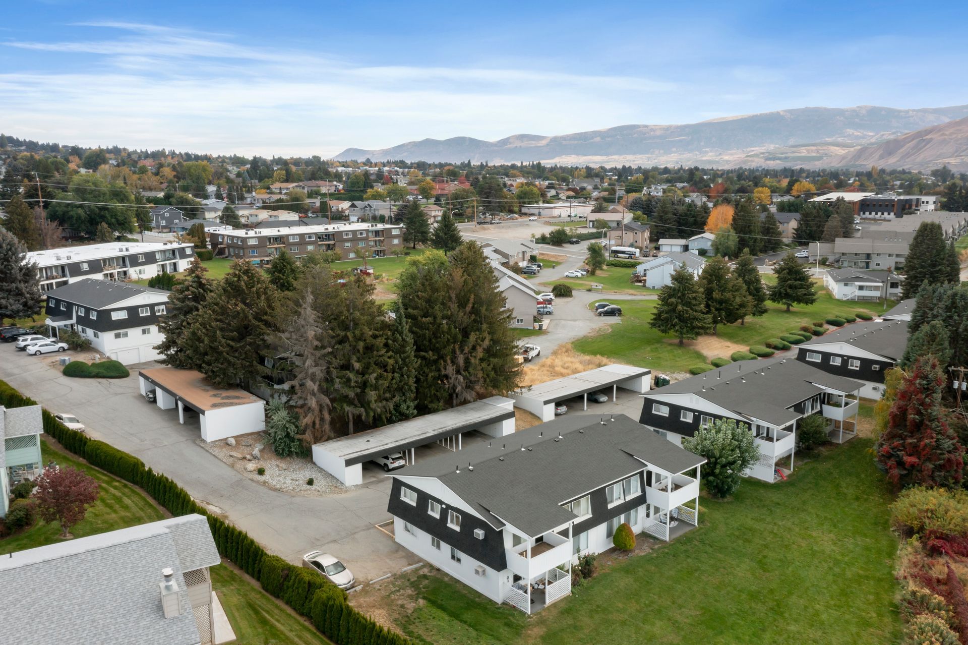 An aerial view of a residential area with a lot of houses and trees.