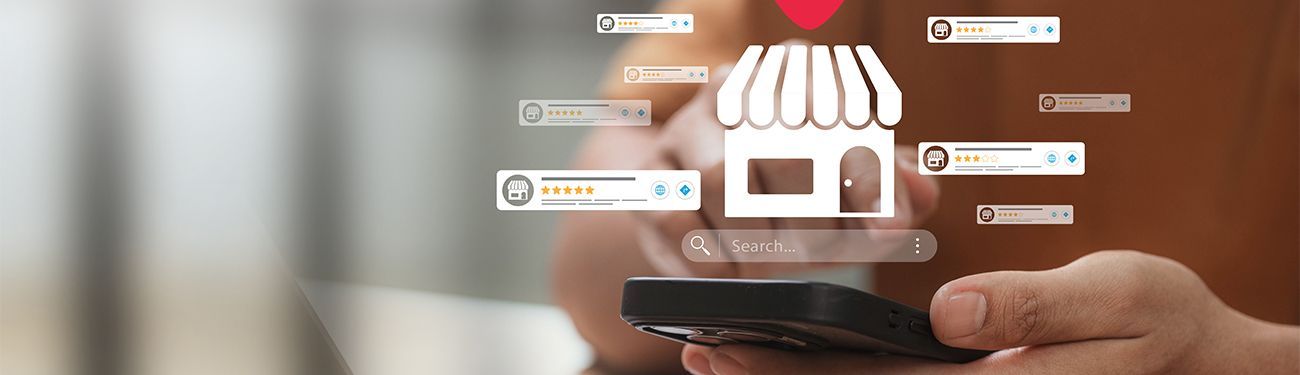 Hand holding smartphone with a glowing online store icon and shopping cart overlays