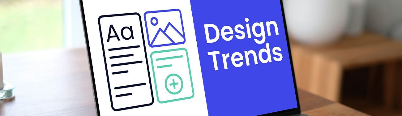 A group of older adults are sitting around a table looking at a newsletter.