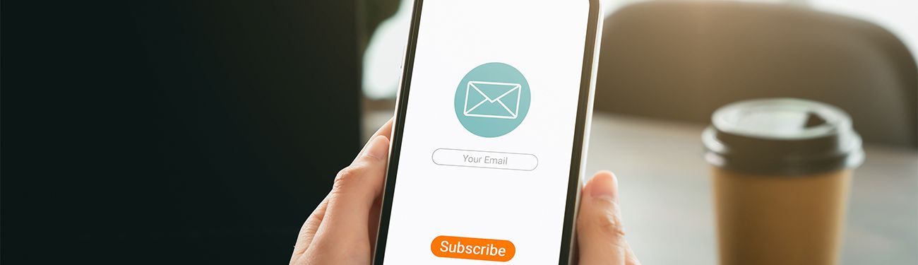 A person is holding a cell phone in their hand.