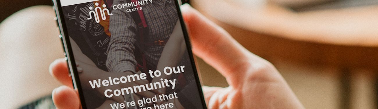 A person is holding a cell phone in their hand.