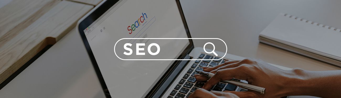 A person is typing on a laptop computer.