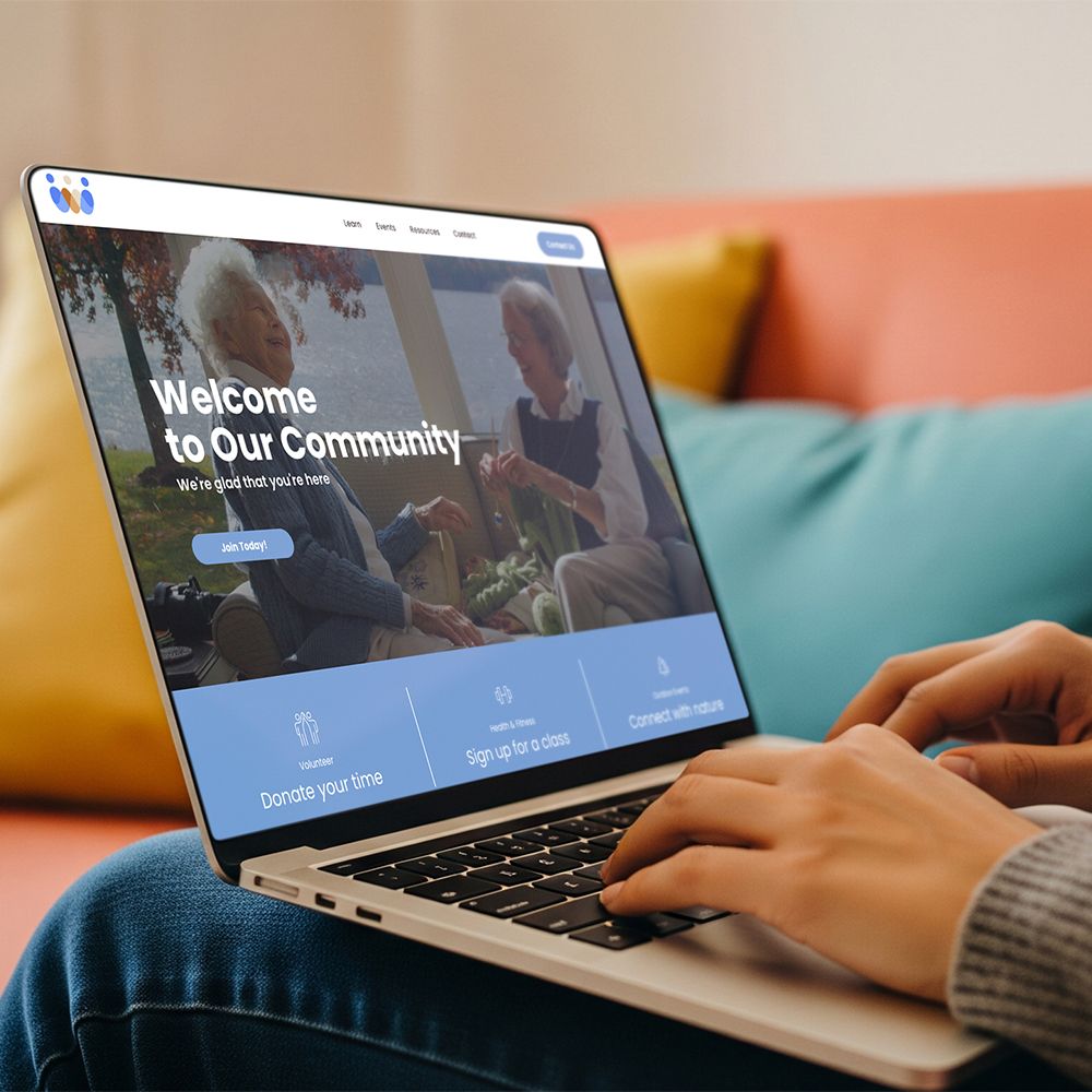 A person types on a laptop displaying a