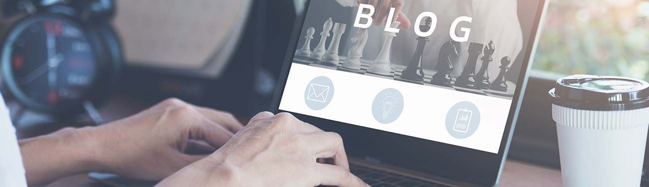 A person is typing on a laptop computer.