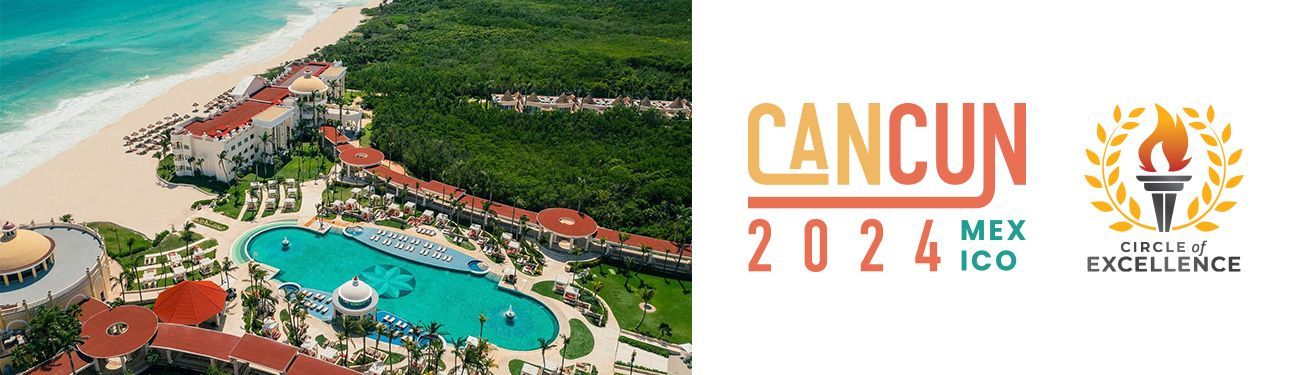 An aerial view of a resort with a pool and a beach.