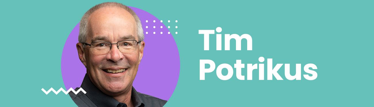 A man with glasses is smiling in a purple circle on a blue background.