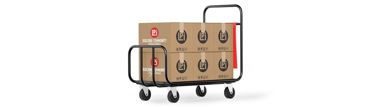 A cardboard box is sitting on top of a cart.