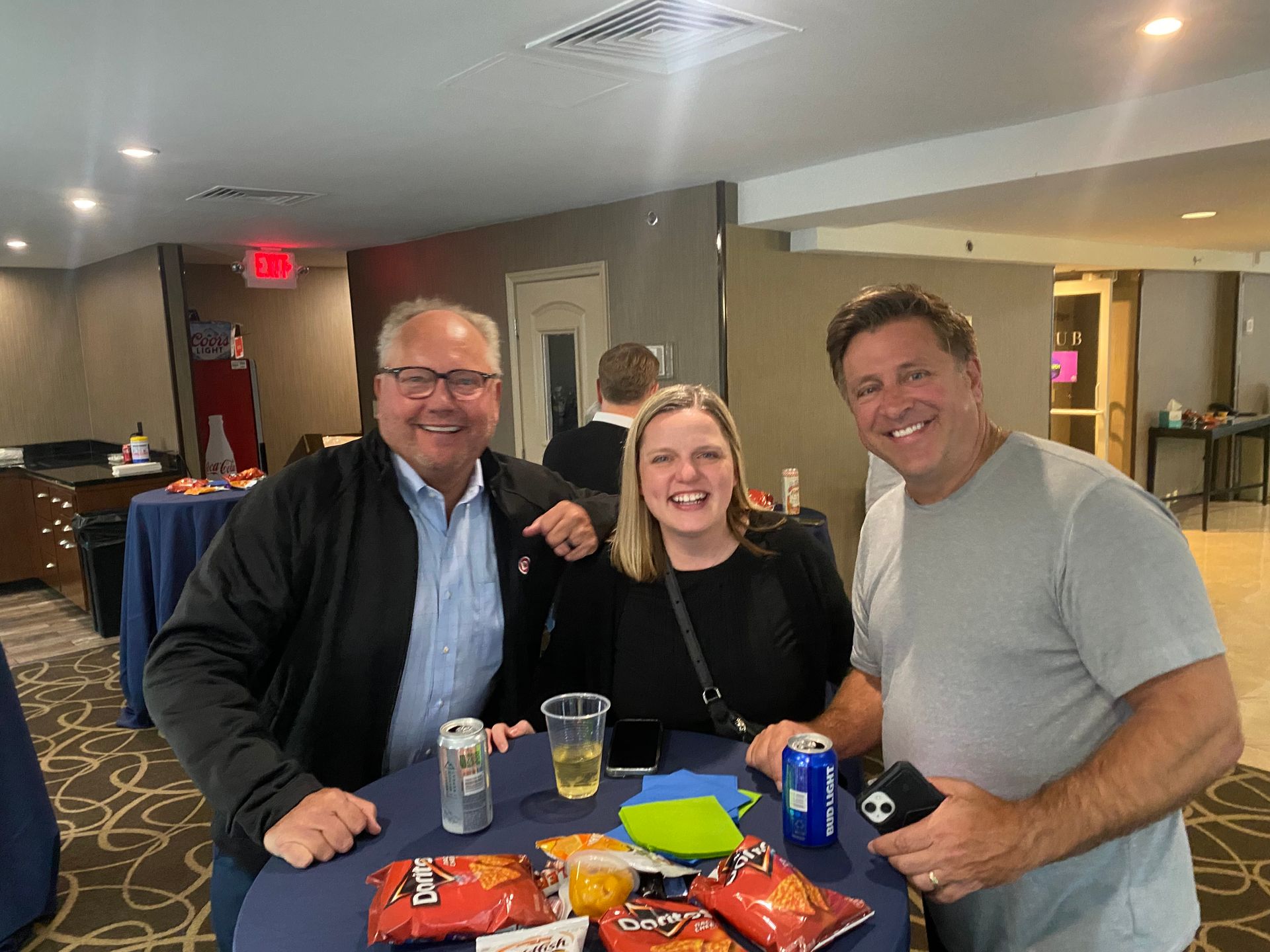 Three people smiling for the camera