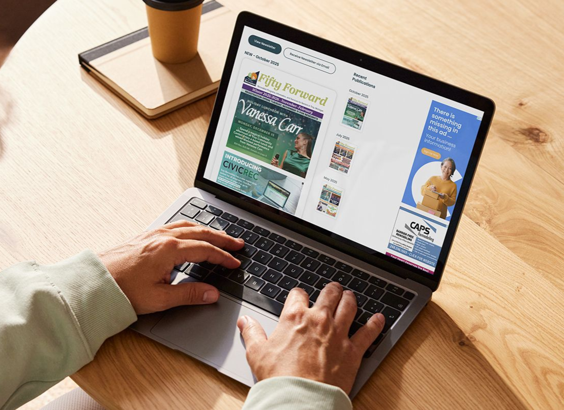 A person is typing on a laptop computer.