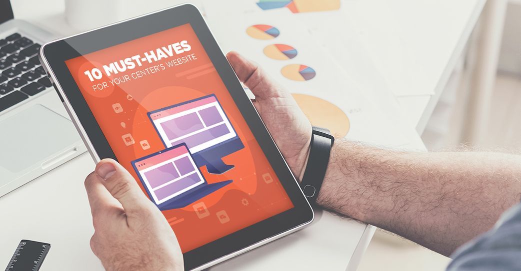 A person is holding a tablet in their hands.