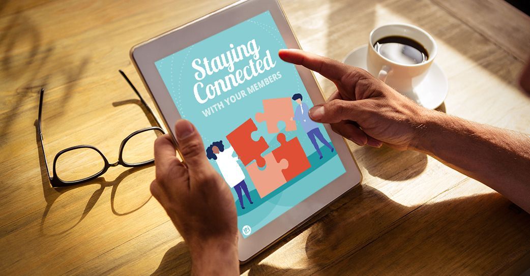 A person is holding a tablet with a puzzle on the screen.